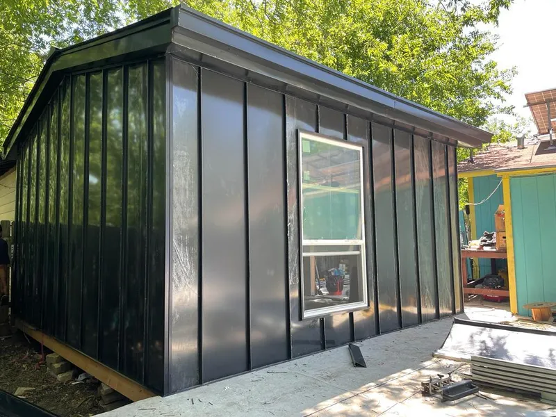 Black standing seam metal wall panels for Roof Inspection in Plainville